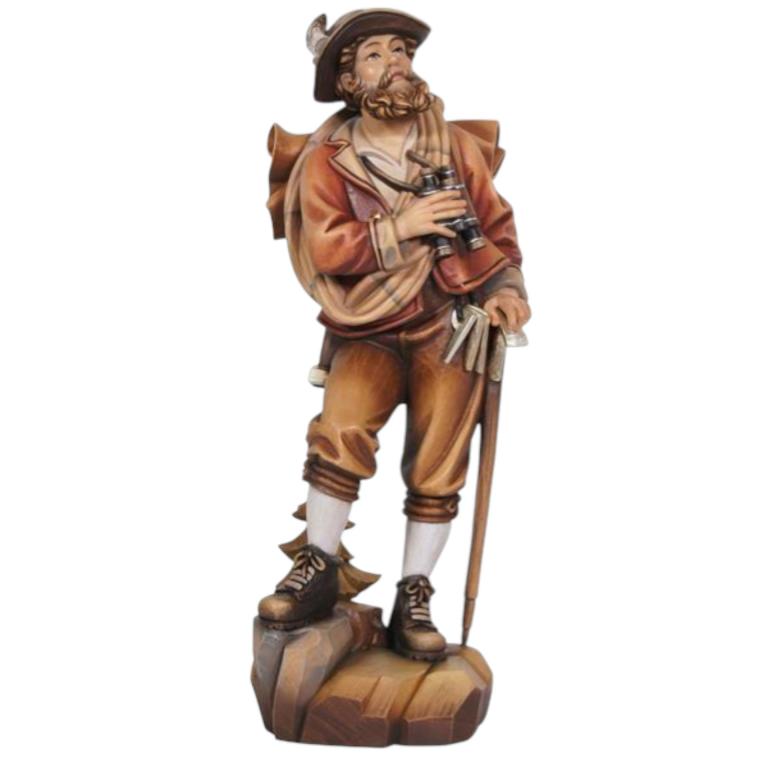 bergsteiger aus holz mit fernglas und wanderstock traditionell geschnitzt